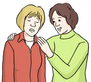 Auf dem Bild sind zwei Personen zu sehen. Eine sieht traurig aus. Die andere tröstet sie.